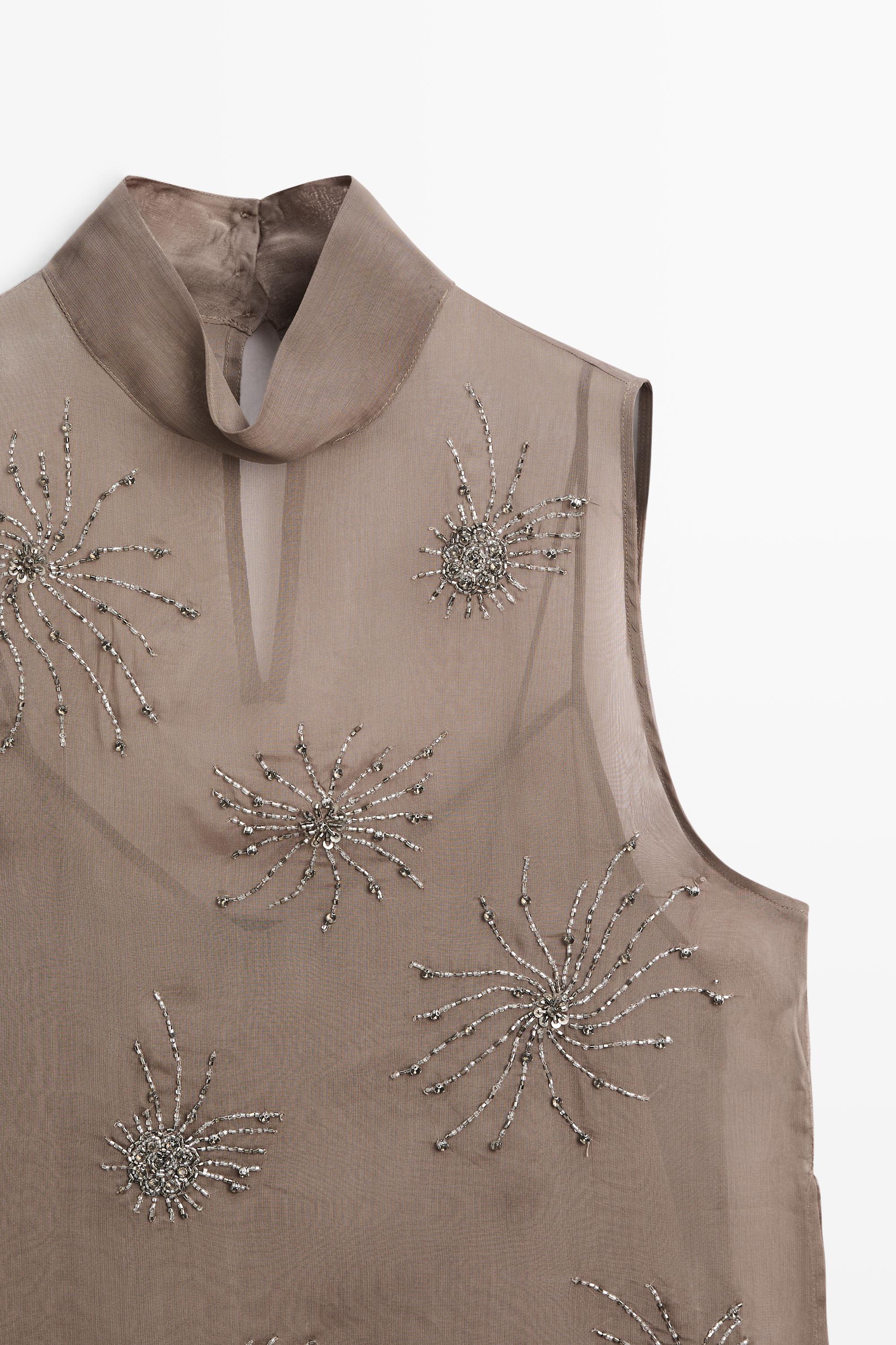 Semi-sheer top with embroidered detail